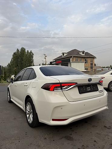 калпаки на диски: Toyota Corolla: 2021 г., Гибрид, Седан — 5
