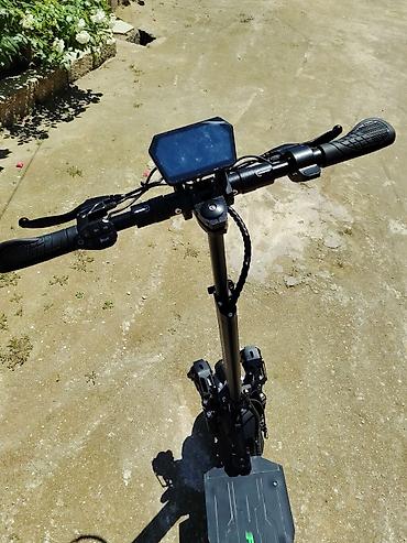 Elektrikli samokatlar: Elektrik skuter – off-road tipli, iri dişli təkərlər və güclü asqı — 4
