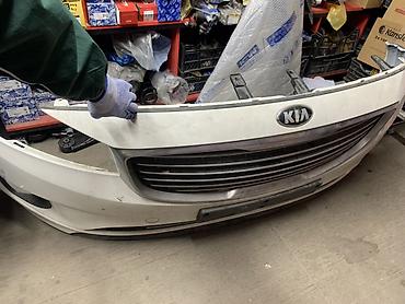 Передний бампер Kia — в сборе с решёткой радиатора и эмблемой KIA