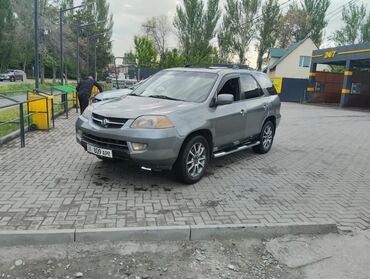 срочно продам авто в связи с переездом: Внедорожник Acura MDX серого цвета, оснащенный люком на крыше