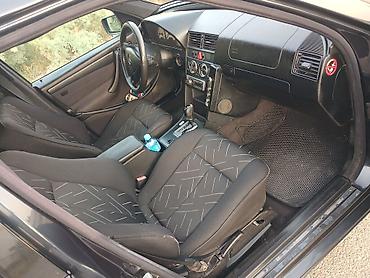 arxa şuşə: Mercedes-Benz C-Class универсал, 500 T modifikasiyası. Avtomobil qara — 9