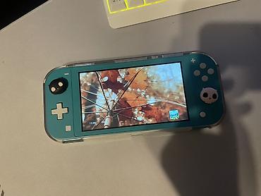 Nintendo Switch (Lite): Nintendo Switch Lite, бирюзовый - Компактная портативная консоль — 1