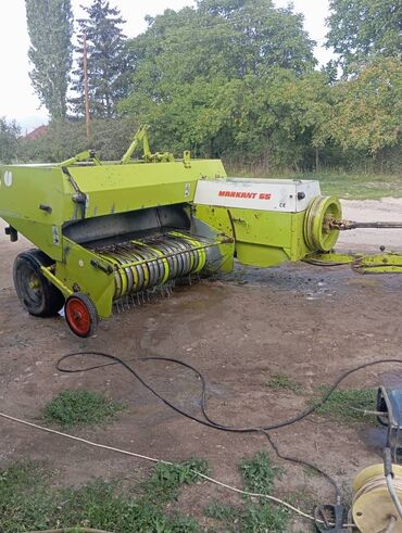 молочное оборудование: Пресс-подборщик Claas Markant 65 в светло-зеленом цвете