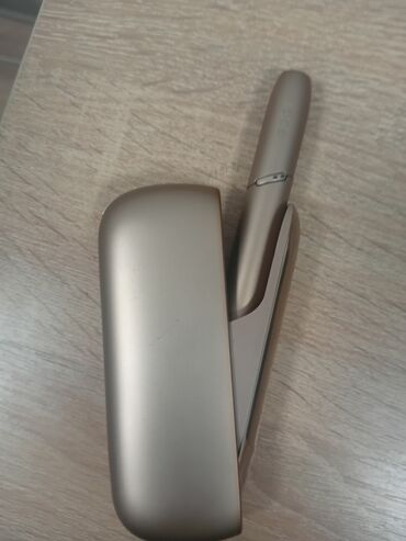 Qəlyan, vayp və aksesuarları: IQOS cihazı, tütün çubuqlarını qızdırmaq üçün nəzərdə
