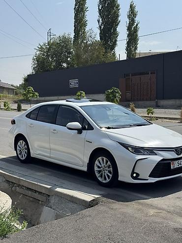 оптика е39: Toyota Corolla: 2021 г., 1.8 л, Автомат, Гибрид, Седан — 2