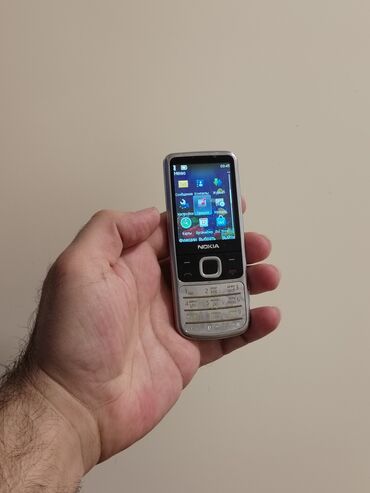 Nokia: Nokia 6700 Slide, 2 GB, rəng - Gümüşü, Düyməli