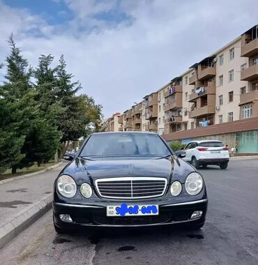 Boşqablar: Mercedes-Benz E 320: 3.2 l | 2003 il Sedan