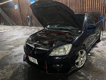 bmw ix3: Mitsubishi Lancer: 2005 г., 2 л, Механика, Универсал — 2