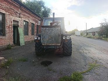 другой: Трактор колесный с навесным плугом Описание: - Колёсный трактор — 5