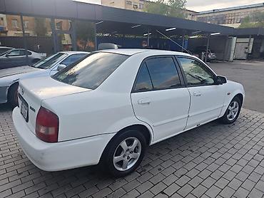 мазда вамиля: Mazda Familia: 2003 г., 1.5 л, Автомат, Бензин, Седан — 2