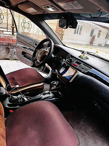 климат одиссей: Mitsubishi Lancer: 2004 г., 1.6 л, Типтроник, Бензин, Универсал — 5