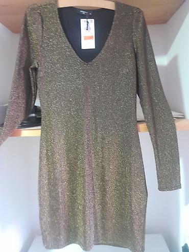 Haljine: Šljokičasta mini haljina sa dugim rukavima - Materijal: elastična — 1