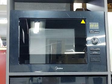 Встраиваемая микроволновая печь Midea в чёрном цвете. Лаконичный