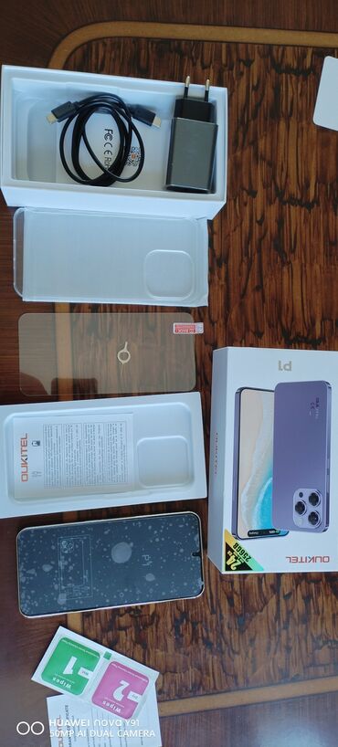 телефон fly iq4405 quad: Oukitel P1 modeli smartfon, süd rəngdə, 24GB RAM və 256GB daxili