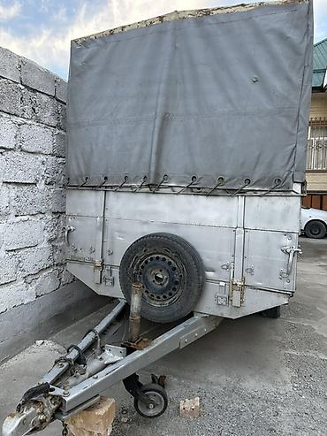 w210 55: Прицеп-тентованный двухосный, грузоподъёмность до 2,5 т. Длина 3.5.м — 2