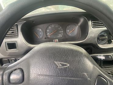 машина берем: Daihatsu Cuore: 2002 г., 1 л, Механика, Бензин, Хэтчбэк — 6