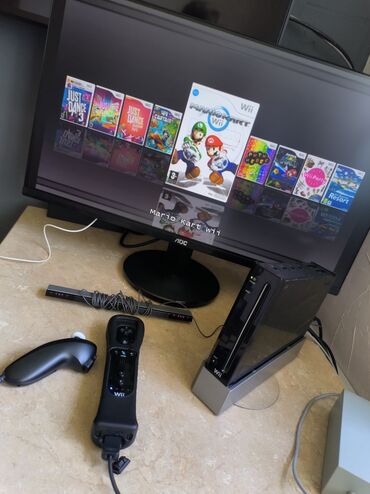 купить бу диски на playstation 4: Продаю оригинальную Nintendo Wii 32 Гб. Прошита, установлено 10 игр