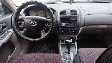 автомобиль фит: Mazda 323: 2002 г., 1.6 л, Автомат, Бензин, Хетчбек