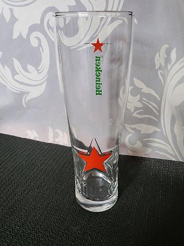 Čaše: Case nove za pivo Heineken. Case nove,sve na njima odsjaj od svetla — 11