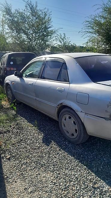 e6 3: Mazda Familia: 2002 г., 1.6 л, Автомат, Бензин, Седан — 1