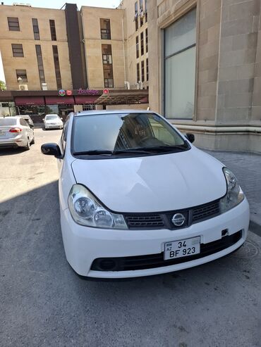 Nissan Wingroad: 1.5 л | 2014 г. Универсал