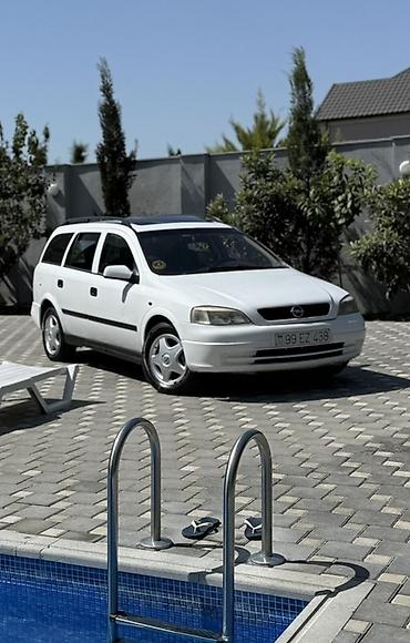 opel astra maşın: Opel Astra Caravan (ağ), universal kuzov - Geniş yük və sərnişin — 1