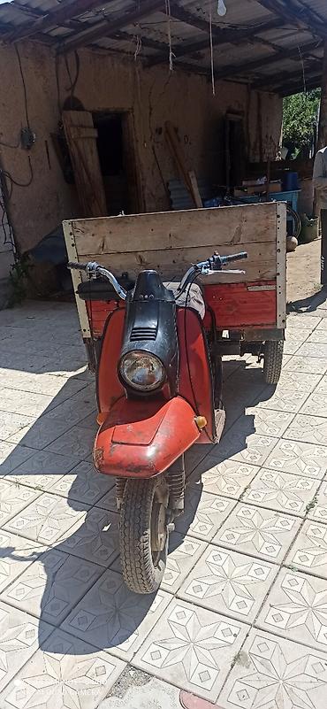 Унаа: Грузовой мотороллер-трицикл с кузовом — 1