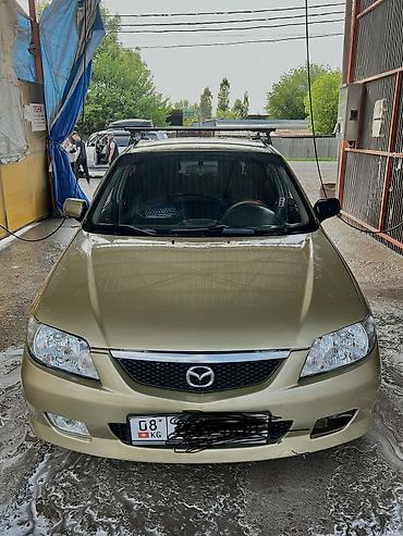 Mazda: Mazda 323: 2003 г., Бензин — 1