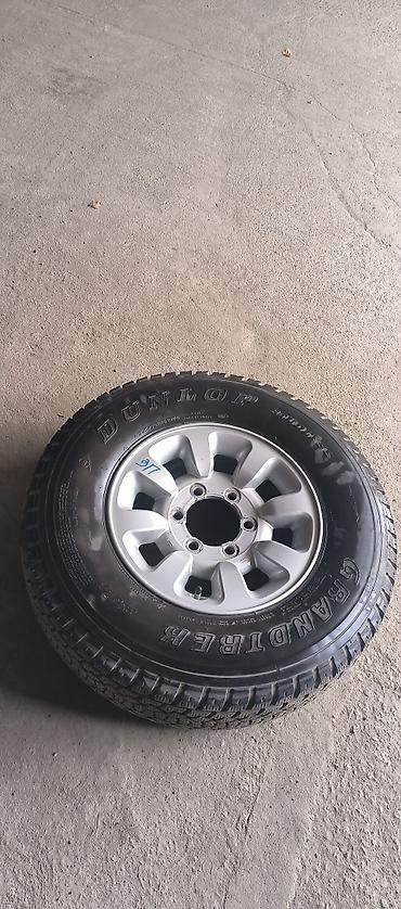 285 75: Диск с шиной в сборе. - Шина: Dunlop Grandtrek KW405 - Размер: 235/75 — 4