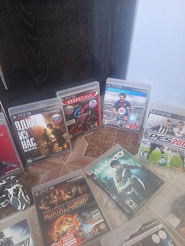 PS3 (Sony PlayStation 3): Игровая консоль Sony PlayStation 3 (модель Slim) с набором дисков — 5