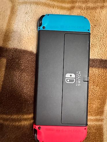 nintendo da: Nintendo Switch (OLED model) oyun konsolu – neon qırmızı və neon mavi — 2