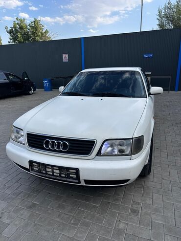 субару аутбек 2004 цена бишкек: Белый седан Audi A6 с характерным дизайном кузова и передней решеткой