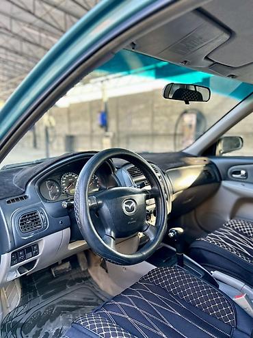 50 55: Mazda 323: 2001 г., 1.6 л, Автомат, Бензин, Хэтчбэк — 7