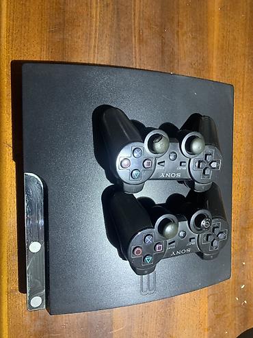 игровые консоли nintendo switch: Sony PlayStation 3 Slim + два беспроводных геймпада DualShock 3 - — 1