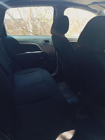 mini qadin masinlari: Ford Fiesta hatchback, 2007 il 1.3 matortünd göy rəng. 5 qapı, kompakt — 7
