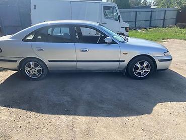 бампер опель вектра с: Mazda 626: 1998 г., Седан — 2