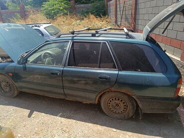 Другие детали кузова: Универсал Mitsubishi Lancer, модель пятого поколения, в темно-зеленом — 8