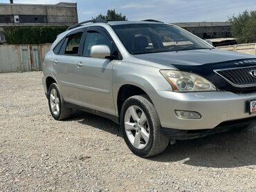 шины для фронтального погрузчика: Серебристый внедорожник Lexus RX 330 с характерным дизайном и