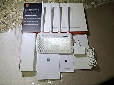 iphoni 11: Xiaomi Mi Router 4C – 300 Mbps Wi‑Fi router Xüsusiyyətlər: - 2.4 GHz — 2