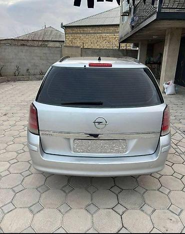 opel təkərləri: Opel Astra Caravan (universál kuzov), gümüşü rəng. Əsas məlumat: - — 2