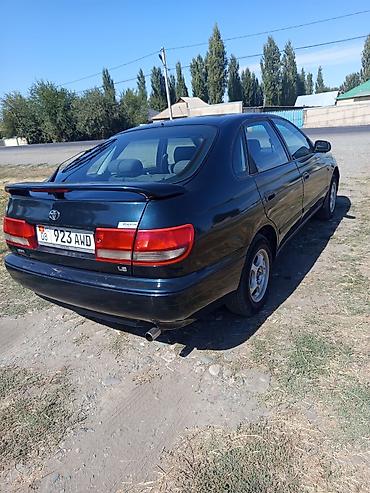 дайхатсу мира: Toyota Carina E: 1996 г., Механика, Бензин, Седан — 5