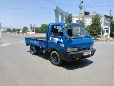 шины бу бишкек оптом: Грузовой автомобиль Hyundai Porter синего цвета с плоской платформой