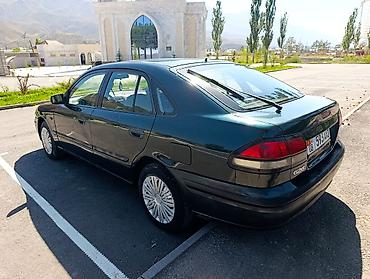 385 55: Mazda 626: 1997 г., 1.8 л, Механика, Бензин, Седан — 7