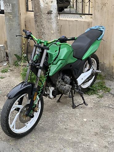 motosiklet harley davidson: Motosiklet – küçə/naked üslubunda, yaşıl-qara rəng sxemi ilə. Texniki — 6