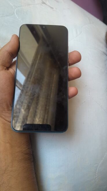 игровой ноутбук баку: Ön tərəfində damcı çentikli və nazik çərçivəli smartfon. Cihazın