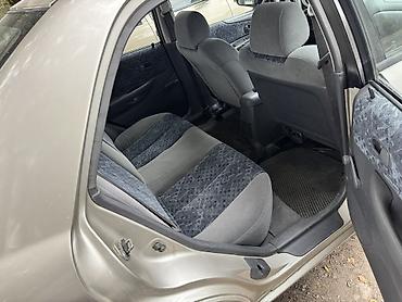 пленка авто: Mazda 323: 1998 г., Механика, Бензин, Седан — 5