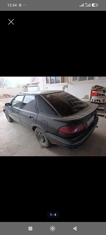 Унаа: Toyota Corolla: 1990 г., 1.3 л, Кол менен иштөөчү, Бензин, Лифтбек — 4