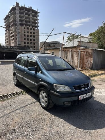 запчасти на опель зафира б: Минивэн Opel Zafira, окрашенный в темно-зеленый цвет. Автомобиль
