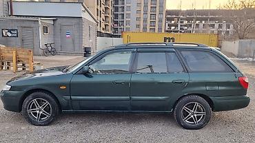 козырек 124: Mazda Capella: 2000 г., 2 л, Механика, Бензин, Универсал — 3