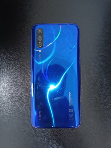 телефон fly fs457 nimbus 15: Xiaomi Mi A3, rəng - Göy, 
 Barmaq izi